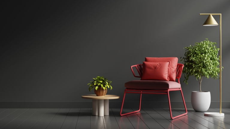 Interior design in dark tones with red armchair on black wall ba